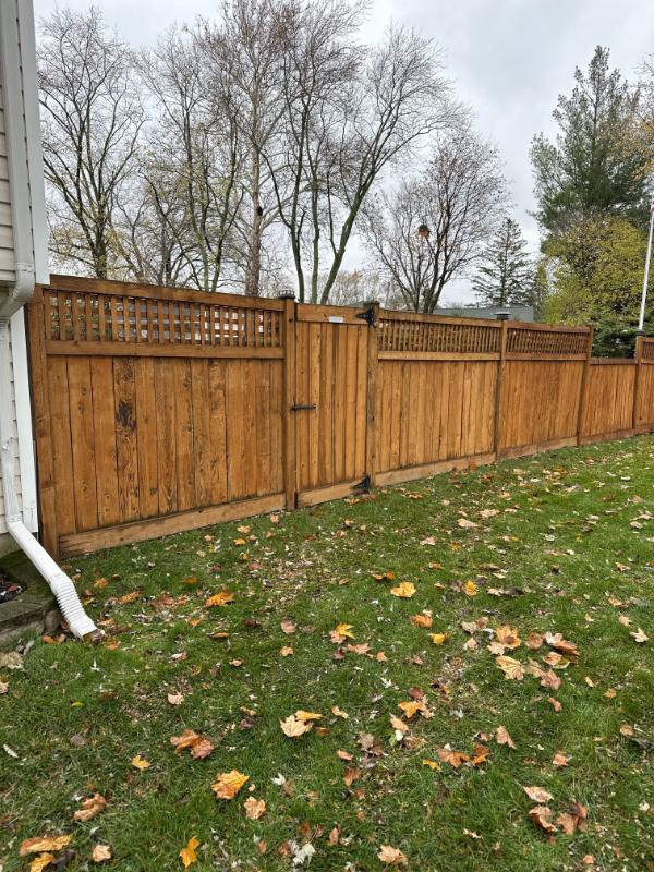 stockade fence with lattice trim
