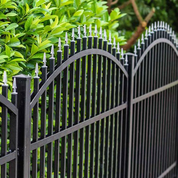 staggered spear picket metal fence by Top Rail Fence