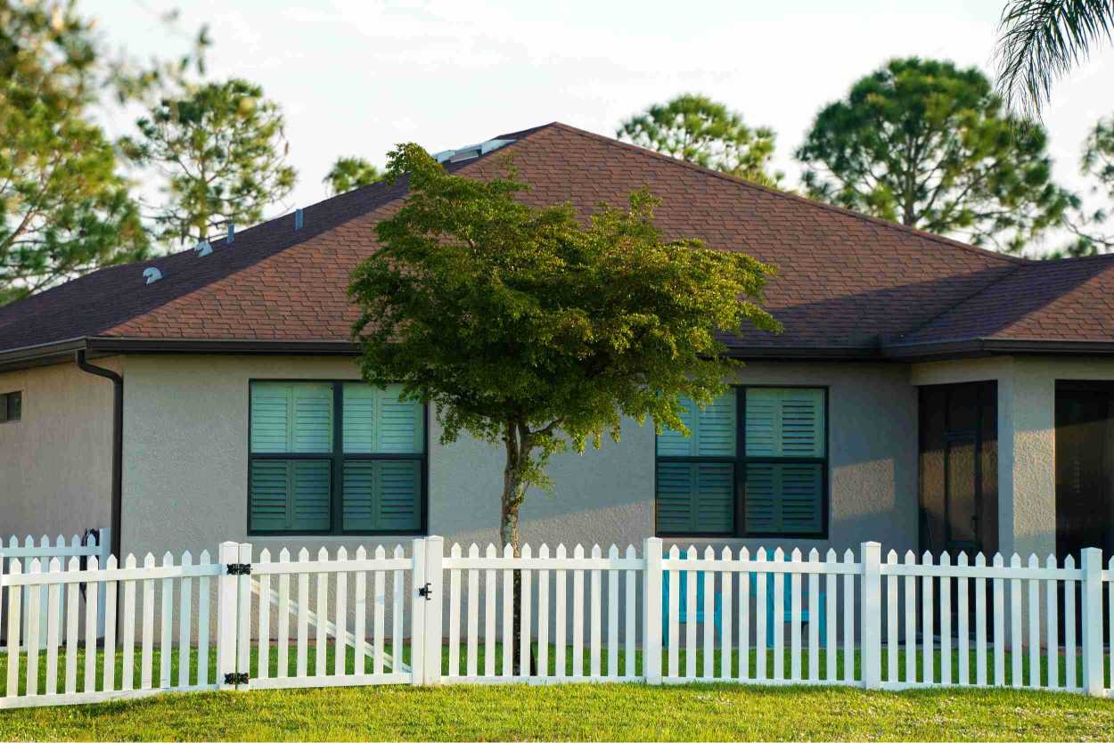 Vinyl picket fence with a gate
