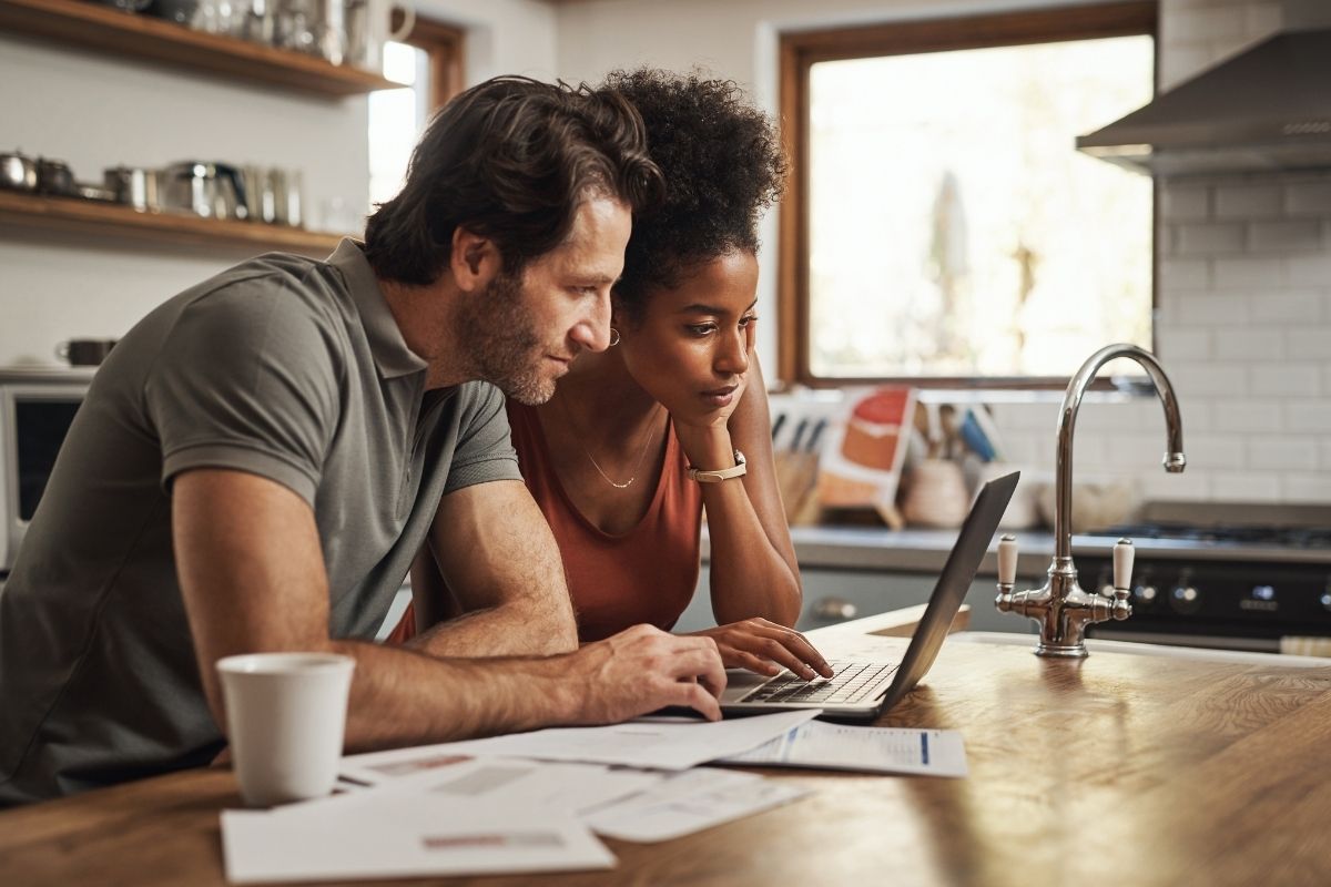 Couple doing research on a laptop computer