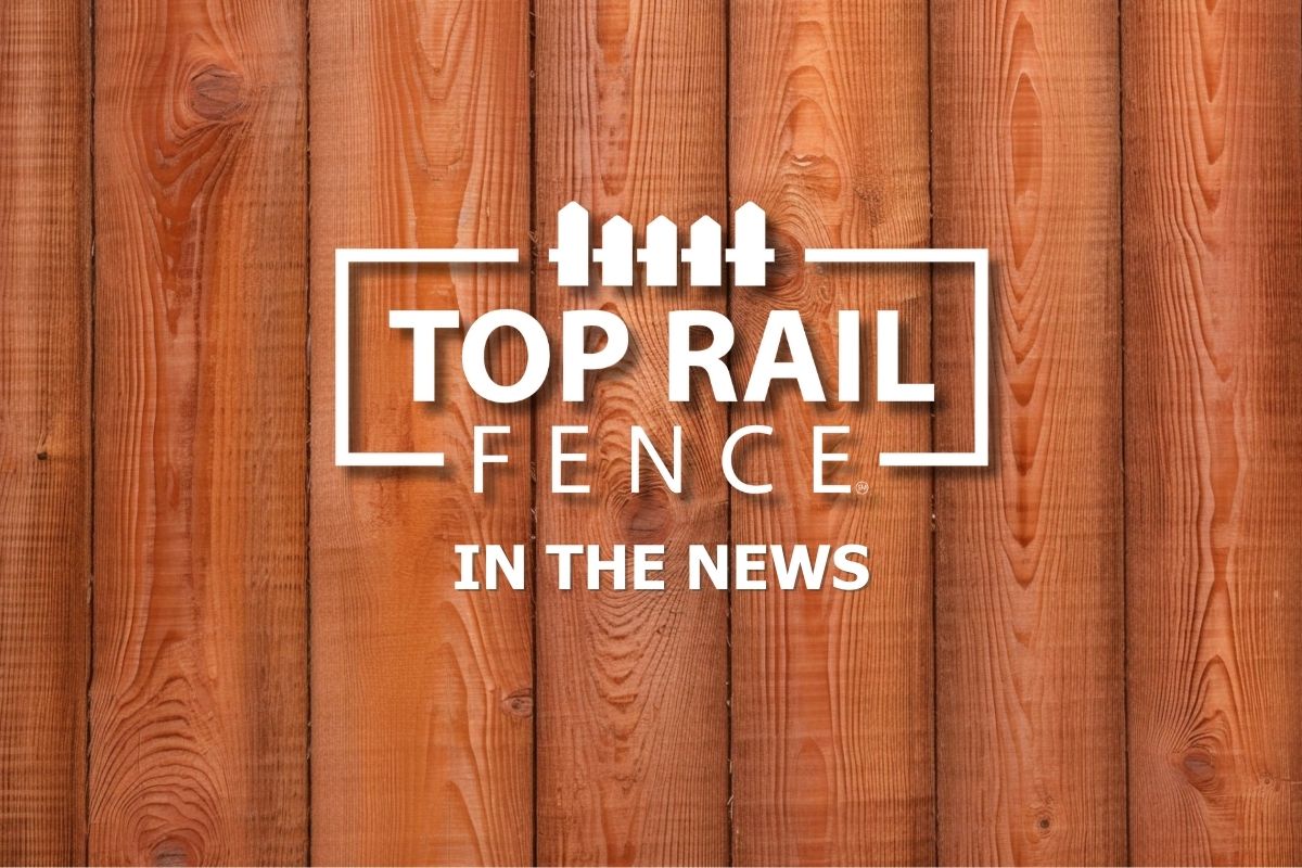 Top Rail Fence In the News Logo overlayed on a fence